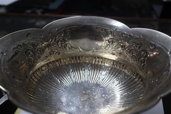 A late Victorian embossed silver two-handled shaped oval bowl, London, 1900, 18.5 oz.